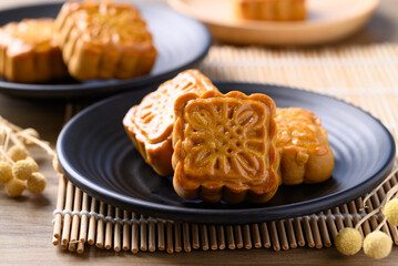 Obraz na płótnie Canvas Chinese mooncake, traditional dessert celebrating in Chinese festival mid autumn or new year