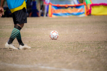 soccer player kicking ball
