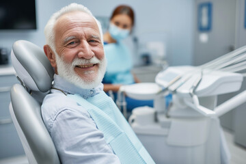 Fototapeta premium Satisfied senior man at dentist's office looking at camera