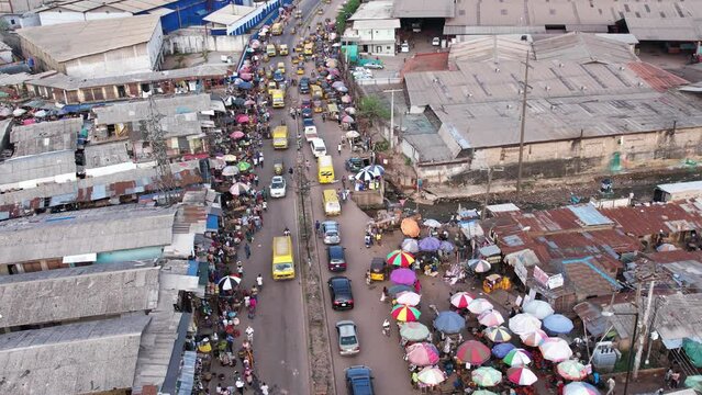 4th March 2023,Abuja Nigeria:Drone  Aerial crowd shot of African people, a huge queue of cars,trucks  drive at cross road. Traffic highway transportation in Nigeria Africa