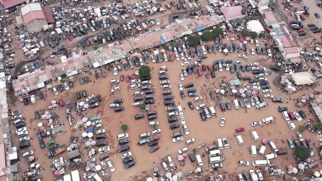 4th March 2023,Abuja Nigeria:Drone  Aerial crowd shot of African people, a huge queue of cars,trucks  drive at cross road. Traffic highway transportation in Nigeria Africa