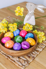Easter eggs and table decor top view. easter still life with eggs and tulips, easter eggs and tulips on wooden background