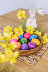 Easter eggs and table decor top view. easter still life with eggs and tulips, easter eggs and tulips on wooden background