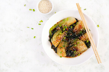 Homemade asian sauteed soy bok choy with sesame seeds. Stir fry pak choi. Asian food. Top view