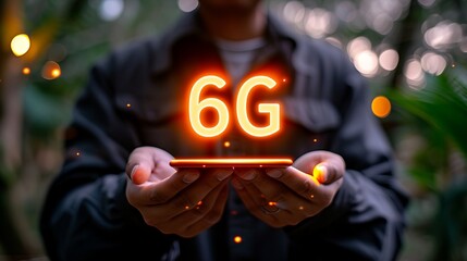 Interactive holographic mobile phone displaying a shining 6g text icon in the hands of a user.