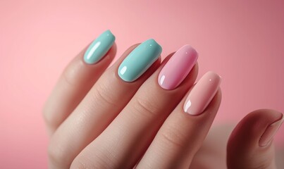 Female hand with pink and blue nail design. Nail polish manicure.