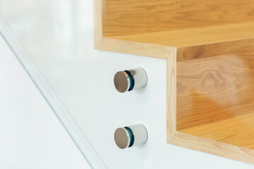 Glass balustrade mounting support pins for staircase.