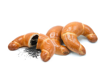 Freshly baked croissant with poppy seed filling isolated on white background.	