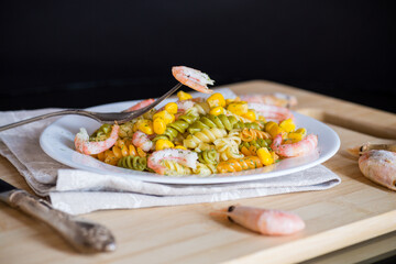 colored vermicelli with shrimp, sweet corn in a plate