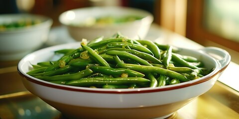 A bowl filled with fresh green beans placed on top of a table. Perfect for recipes, healthy eating, and farm-to-table concepts