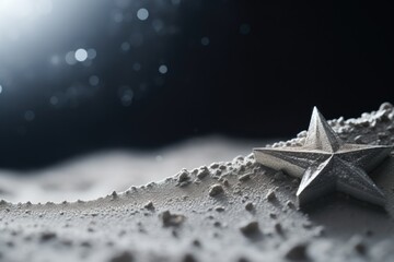 A silver star sits on top of a sandy beach. This picture can be used to represent a peaceful and serene beach setting