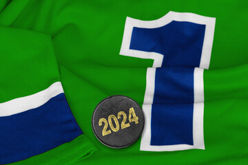 Green hockey jersey and puck