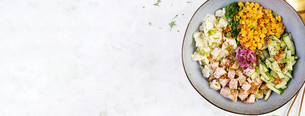 Chinese cabbage salad with chicken meat, corn, cucumber and dressing mustard. Asian food. Top view, banner