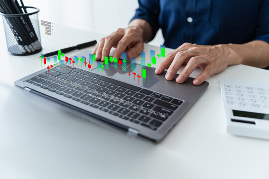 Man using laptop with chart or graph. Success and growth idea of trader. Investor data analysis for planning in strategy of stock market fund. Invest for earning or profit. Financial and bank concept.