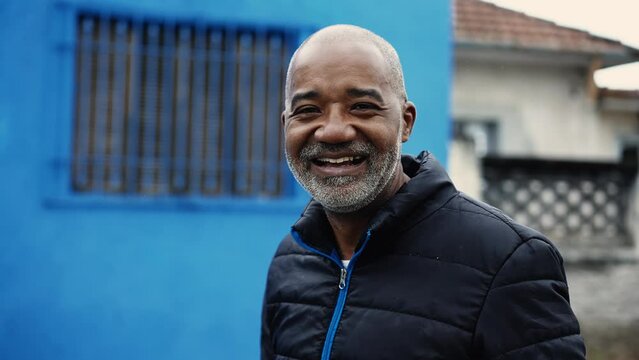 Happy Middle-Aged Black Man Walking Forward In Urban Environment, Portrait Of A 50s African American Man In Street Movement