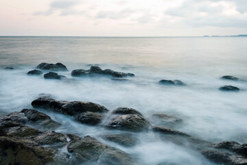Sunset on the rocky shore.