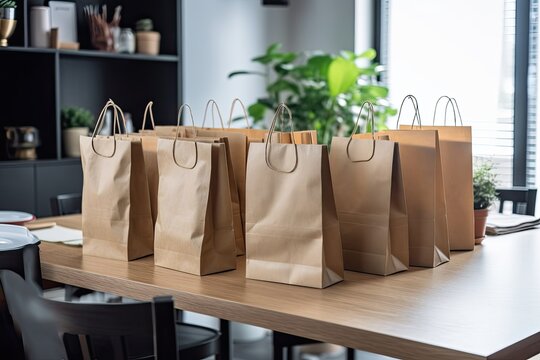 Courier Service For Food Delivery Using Takeout Paper Eco Bags Standing At A Desk In A Contemporary Apartment At Home