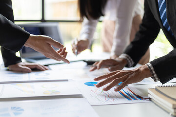 Business people meeting together brainstorming business strategy analysis and investment planning. Financial consultant discuss analysis financial chart and market growth graph for business planning.