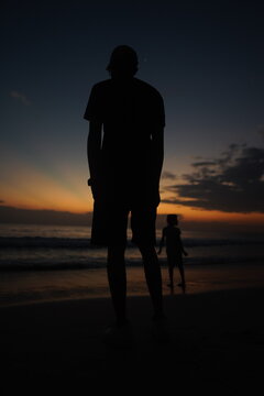 silhouette of a couple on the beach at sunset timor leste
