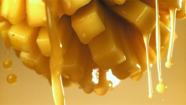 The juice flows through the sliced mango fruit. Filmed on a high-speed camera at 1000 fps. High quality FullHD footage