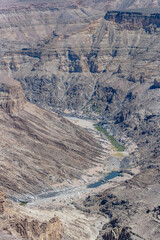 steep slopes on Fish river with little water,  from Canyon viewpoint at Fish River Canyon,  Namibia