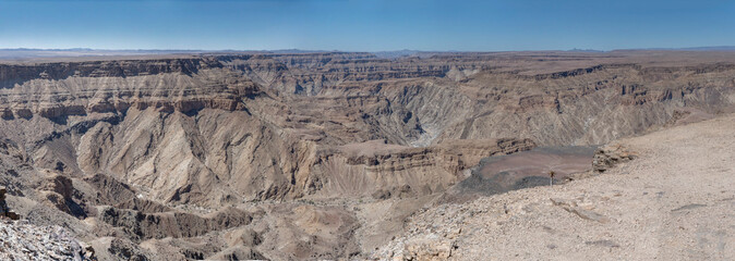 escarpment worn slopes and meandering dry riverbed looking west from Sunset viewpoint, Fish River Canyon,  Namibia