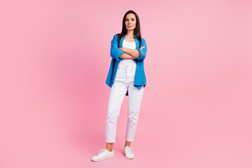 Full length photo of serious gorgeous woman wear stylish clothes white pants holding arms crossed...