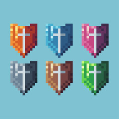 Pixel art sets icon of shield variation color.Gold shield icon on pixelated style. 8bits perfect for game asset or design asset element for your game design. Simple pixel art icon asset.