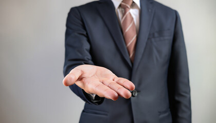 Obraz premium ビジネスマン、手を差し出すポーズ