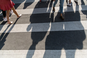 Shadows of people on the crosswalk