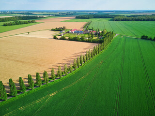 Aerial drone view of green fields and meadows in Yveliness,, near Paris, France