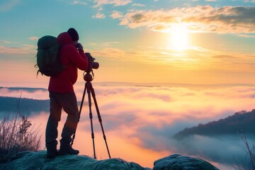 A daring mountaineer captures the breathtaking sunset from atop a towering mountain, equipped with trekking poles and a camera to document their thrilling outdoor adventure - obrazy, fototapety, plakaty