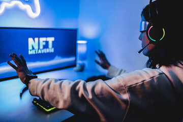 Young gamer buying NFT with token on marketplace platform for metaverse video game. Crypto...