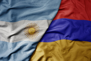 big waving national colorful flag of armenia and national flag of argentina .