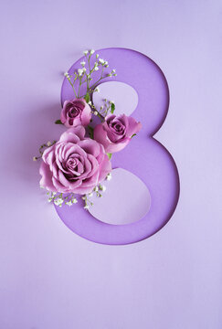Violet roses with number 8. International Women's Day. Vertical photo