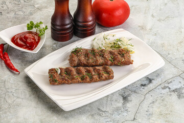 Kebab with beef served onion