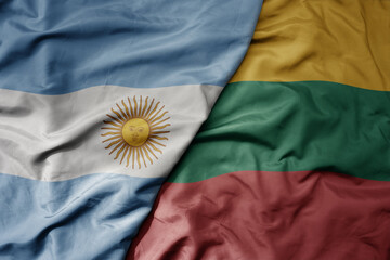 big waving national colorful flag of lithuania and national flag of argentina .