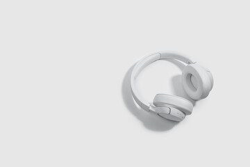 White headphones lying on a white table