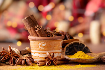 various spices and dried orange slices, lights on bokeh background. Still life - 724838341