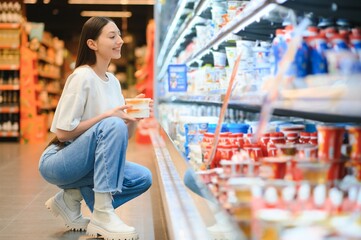 Young cool customer woman wear casual clothes shopping at supermaket store grocery shop