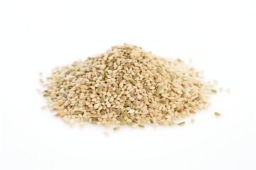 a heap of hulled hemp seeds on a white surface