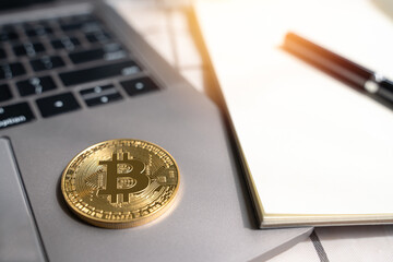Gold Bitcoin Crypto investment and trade concept. Bitcoin Cryptocurrency logo symbol on computer laptop and tablet on white desk with copy space for texting. Virtual Crypto coin as Bitcoin is future. - 724853579