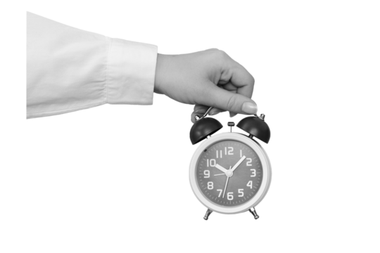 Black and white hand holding a classic alarm clock isolated on transparent background - element for collage