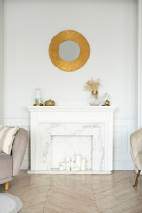 a white marble fireplace with candles is in the living room, there is a mirror in a gold frame on the wall, minimalism, light shades of the room