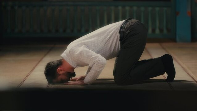 Caucasian Muslim Man Prostrating in Islamic Prayer. Ramadan Praying