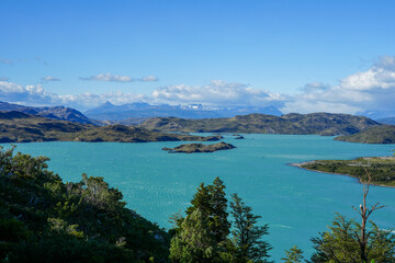 Fototapeta na wymiar Calm Light Blue Lake, Lago Nordenskjöld - Patagonia, Torres del Paine National Park 
