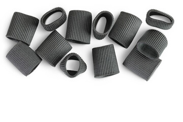 Black pasta with cuttlefish ink isolated on white background with copy space for your text. Top view. Flat lay.