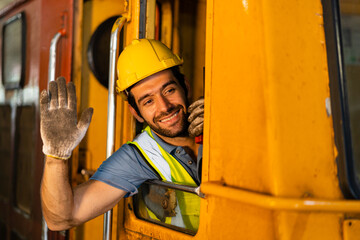 Railway engineer working on a train train. Engineers wear safety suits and helmets at work.