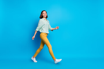 Full size photo of friendly successful gorgeous girl wear turquoise blouse go at work to empty...