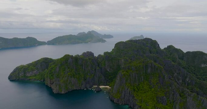 Secret Lagoon and Jiji's Beach, drone view. Miniloc Island. Islands in El Nido, Palawan. Philippines.